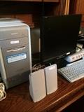 Sony tower; speakers; monitor; keyboard