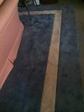 Large blue rug with white inset 