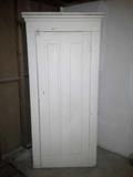 Tall 1-door cabinet in basement