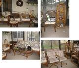Sun porch gorgeous furniture, arched shelving, lamps, a glass terrarium 
