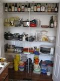 Pots and pans, Tupperware items in kitchen closet