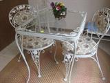 White Cast iron Bistro set with 2 chairs, cushions are removeable