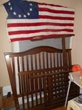 Second Floor - Bedroom #3: A Bicentennial American flag; a full box springs only; and a toddler bed that converts to a full size bed.