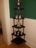 Dining Room: A vintage 5-shelf etagere displays an urn and various porcelain figurines.