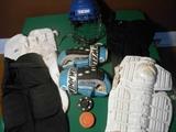 Second Floor-Bedroom #1: Youth size hockey pants, pads, gloves, mask and pucks.