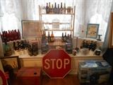Second floor- Bedroom 1: Collectible beer bottles sold for their advertising labels AND various signs.