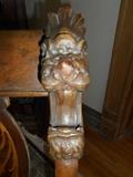 Parlor: A closer view of the antique parlor set's lion head designs on the crest-rail.