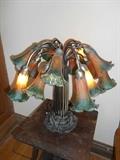 Parlor: A reproduction 16-light Tiffany tulip lamp.