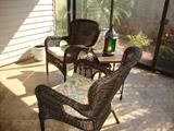 Pair of Wicker Arm Chairs with Cushions
