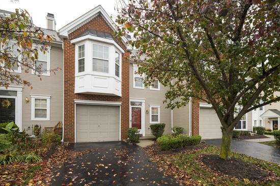 HIGH END IMMACULATE TOWN HOUSE WITH PACKED GARAGE AND LOADED HOME
