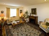 FORMAL LIVING ROOM-W/IMPORTED WOOL CARPET, WORKING ELECTRIC FIREPLACE, ALL FURNITURE REMAINS IN EXCELLENT CONDITION