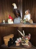 pheasant and eagle figurines and binoculars