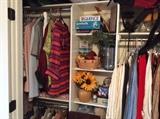 Clothing & miscellaneous in master bedroom closet