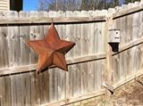 Large metal star in back patio ares