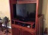 Large entertainment center - doors are not attached but doors still available to put back on.  Tv will also be for sale separate from entertainment center