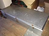 Aluminum under-bed trunk.