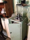Small cabinet and vintage blender.