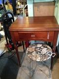Singer sewing machine table and vintage chair.