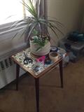 Little tile-top table. There are lots of plants that will need new homes!