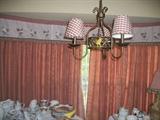 In this picture, you see the light fixture and the window treatments in the kitchen.  The window treatment is in a country motif.  The window is 2 panels 60" wide with a 118" valance.  Very nice.
