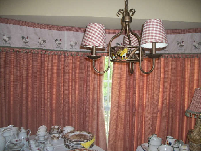 In this picture, you see the light fixture and the window treatments in the kitchen. The window treatment is in a country motif. The window is 2 panels 60" wide with a 118" valance. Very nice.