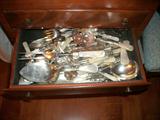 Assorted mother of pearl handled flatware, with sterling silver ferrels.