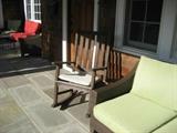 One of Two Teak Porch Rockers
