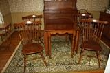 Maple drop leaf table with extension and table pads and 4 matching chairs