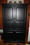 Entertainment Center with doors.  Storage in bottom