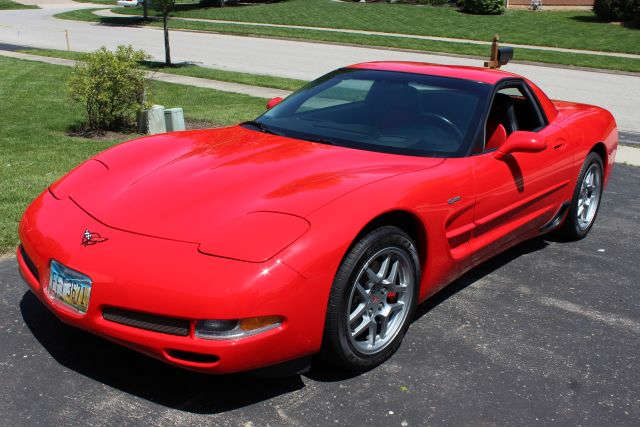 "All This Baby Needs Is A Quart Of Oil & A Racetrack!" - 0 - 60 in 3.9 Seconds -- 2002 Corvette ZO6 With A Torch Red Exterior & Black & Red Seats - Six-Speed Manual Transmission - This Beauty Boasts A 5.7 L 405 HP Engine - The Owner Has Kept This Amazing Vehicle In A Garage And Barely Driven It - Actual Milage Tops Out At A Super-Low 2450 Miles!! - This Is Truly Like New - Features Include 6-way power driver seat, Driver seat with manual adjustable lumbar support, Height adjustable driver seat, Leather, Bucket front seats, Remote power door locks, Power mirrors, Heated mirrors, 2 one-touch power windows, Tachometer, Trip computer, Cruise control, Retained accessory power, Speed-proportional power steering, 12V front power outlet(s), Tilt-adjustable steering wheel, Dual zone climate controls - driver and passenger, Front reading lights, Leather trim on shift knob, Leather steering wheel, Front floor mats, Bose premium brand speakers, 4 total speakers, AM/FM in-dash single CD player ster