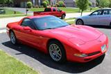 "All This Baby Needs Is A Quart Of Oil & A Racetrack!" - 0 - 60 in 3.9 Seconds -- 2002 Corvette ZO6 With A Torch Red Exterior & Black & Red Seats - Six-Speed Manual Transmission - This Beauty Boasts A 5.7 L 405 HP Engine - The Owner Has Kept This Amazing Vehicle In A Garage And Barely Driven It - Actual Milage Tops Out At A Super-Low 2450 Miles!! - This Is Truly Like New - Features Include 6-way power driver seat, Driver seat with manual adjustable lumbar support, Height adjustable driver seat, Leather, Bucket front seats, Remote power door locks, Power mirrors, Heated mirrors, 2 one-touch power windows, Tachometer, Trip computer, Cruise control, Retained accessory power, Speed-proportional power steering, 12V front power outlet(s), Tilt-adjustable steering wheel, Dual zone climate controls - driver and passenger, Front reading lights, Leather trim on shift knob, Leather steering wheel, Front floor mats, Bose premium brand speakers, 4 total speakers, AM/FM in-dash single CD player ster