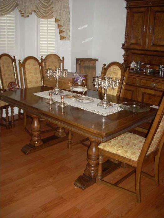 Dining Table with 6 chairs.   The 2 extensions are pictured in the corner.