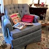 1950-60s comfy lounge chair in steel blue. To the bottom right on the floow is a fabulous OLD rug