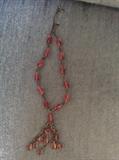 Glass and brass tassel necklace