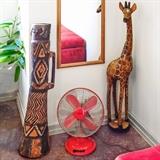 Hand Carved African Drum 32” 110.00, Hand Carved Giraffe 36” 80.00, Retro Red Oscillating Fan 20.00