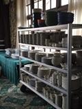 Some of the Dishes, (including Multicoloured Plastic Picnic Ware on the top shelf).
