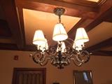One of Two Wrought Iron Chandeliers.