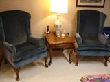 Wingback chairs in blue velvet upholstery