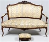 FRENCH CARVED WALNUT SETTEE AND FOOTSTOOL H 45", W 55", D 28"