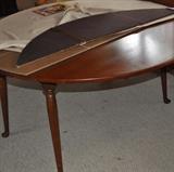 Pennsylvania House 54” round cherry table with two 9” leaves; table pads included.