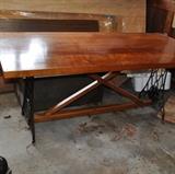 Beautiful handmade table utilizing cast iron sewing machine cabinet bases.