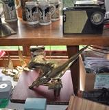 German steins, vintage transistor radio, Keystone movie camera, brass figures, large and heavy brass eagle.
