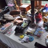 Some vintage baseball mitts, 1950s baseball tropy, Kodak Instamatic camera, old flash bulbs, pin back buttons.