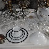 Assorted crystal stemware, Bavarian serving pieces, silver plate in the background.