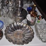 Silver plate, crystal serving piece, crystal decantears, egg cup.