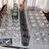 Sets of glassware, vintage postcards, wooden letter tray.