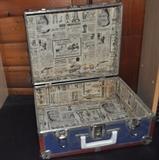 Lined metal suitcase.