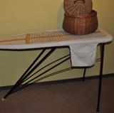Cool 1940s iron ironing board with great cover, sewing basket.