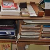 Loads of older office supplies and paper.