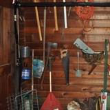 Garage stuff -- tools, garden/yard items, saws, axes, hammers, scythe, basket, rakes, garden chemicals, cords, etc.